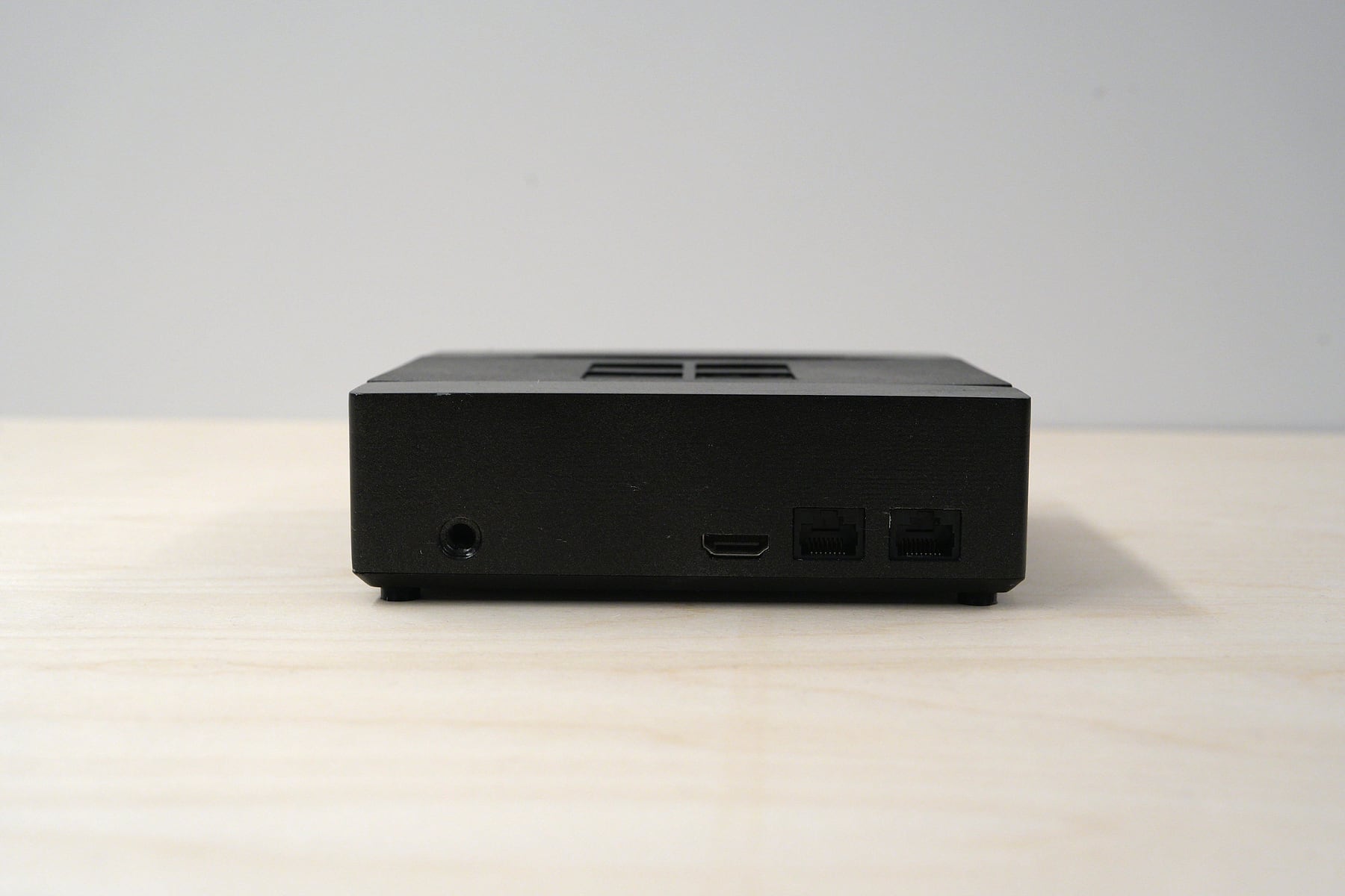 The back of the physical prototype, straight on, showing a power jack, an HDMI port and two ethernet ports along the bottom edge.